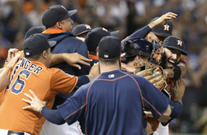 Houston Astros starting pitcher Mike Fiers, right, is mobbed by teammates after his no-hitter against the Los Angeles Dodgers in a baseball game Friday, Aug. 21, 2015, in Houston. The Astros won 3-0. (AP Photo/Pat Sullivan)